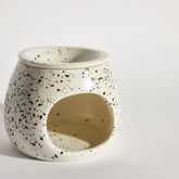 Close-up of Boujie Speckled Ceramic Wax Melt Burner showing speckled texture and curved design.
